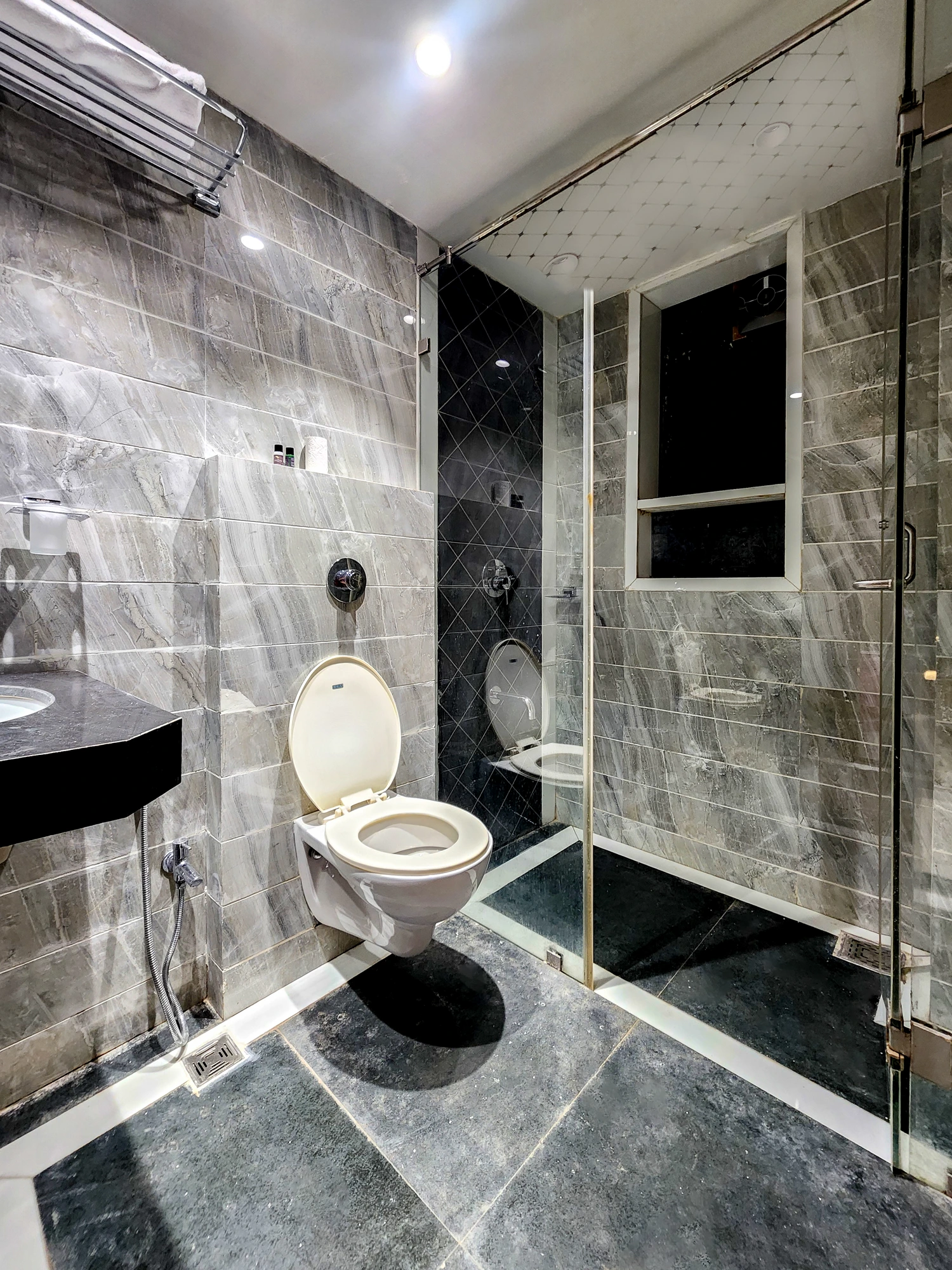 Executive Room marble bathroom at Hotel Falcon Inn, Byculla